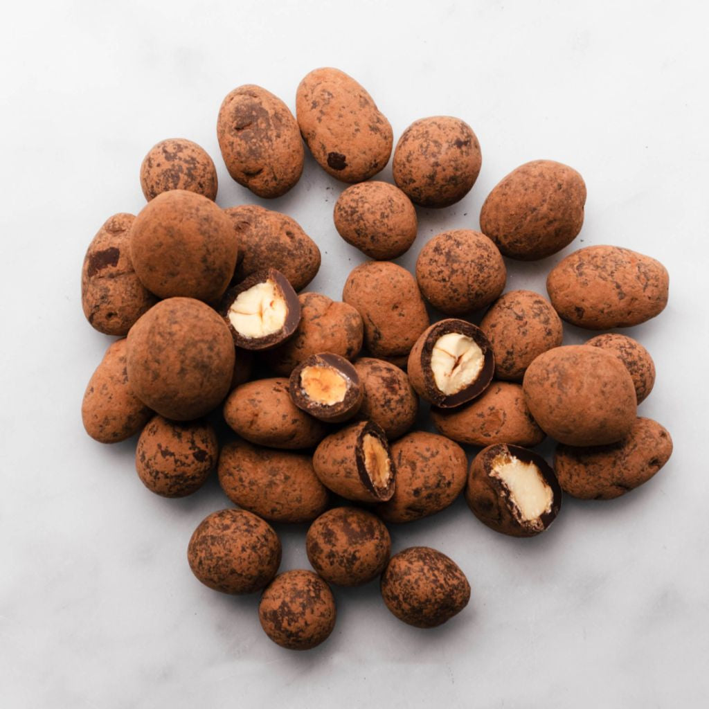 Christmas nut dragees coated in 55 percent cacao dark chocolate