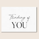 Black and white greeting card with Thinking of You text.