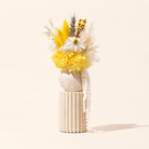 Indie yellow and white dried flower arrangement in handmade vase