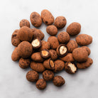 Christmas nut dragees coated in 55 percent cacao dark chocolate