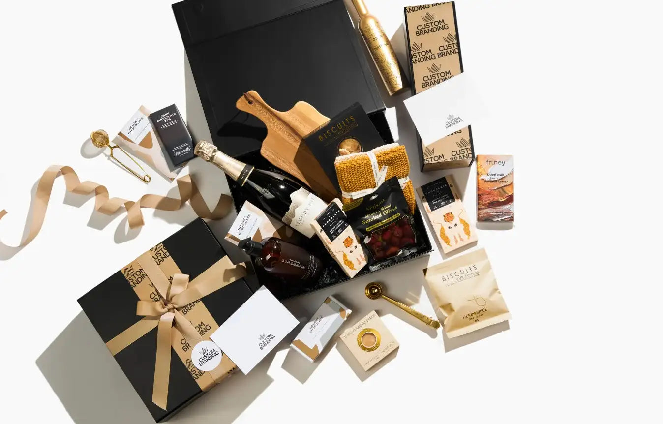 Black gift box with gold ribbon and bow.