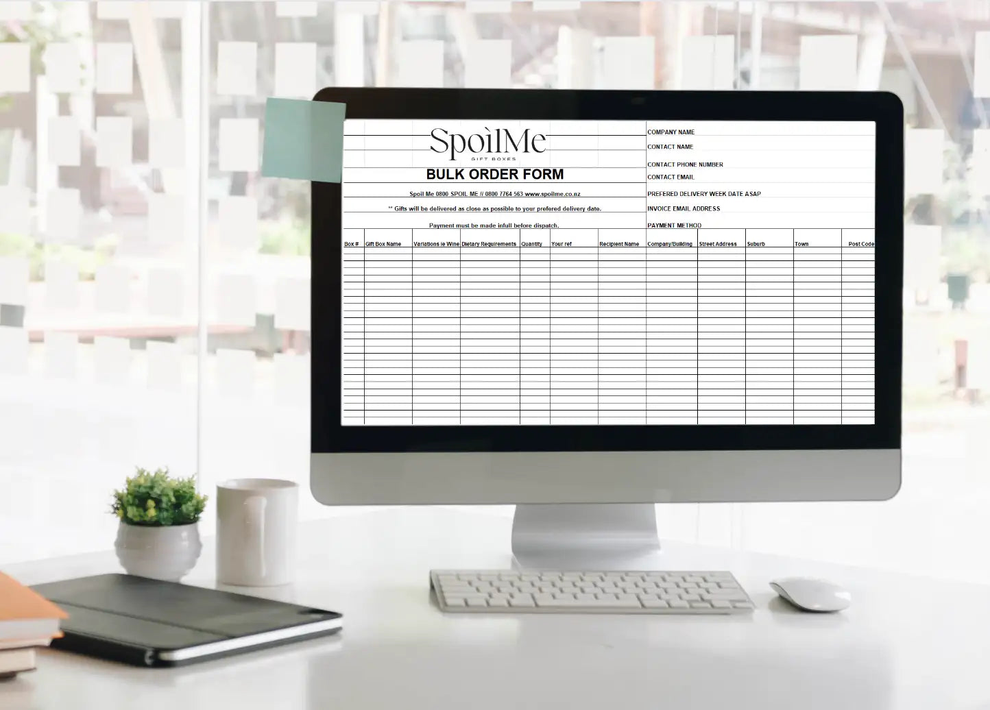 A sleek black and silver computer monitor displaying a ’spoilme’ bulk order form.