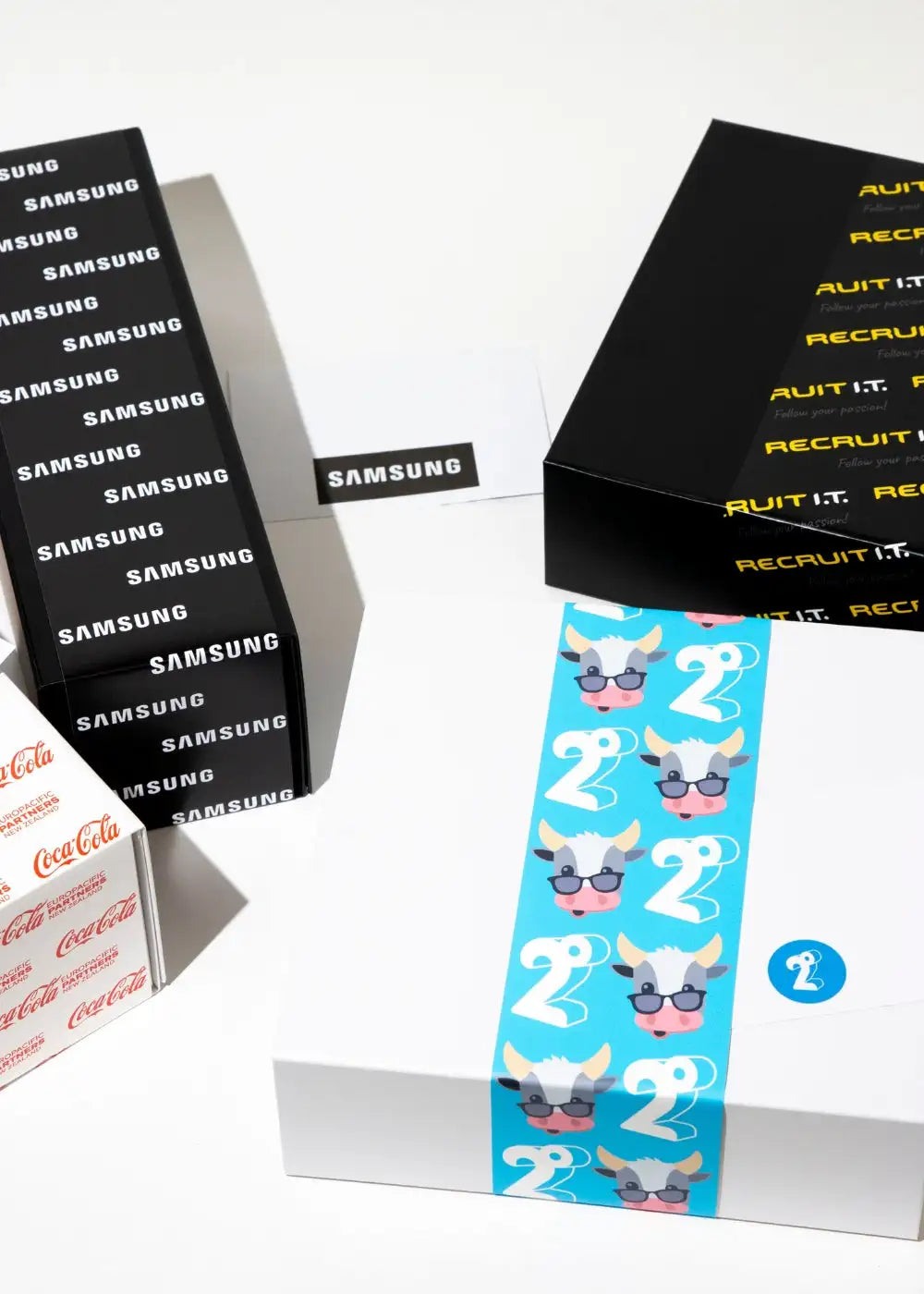 White box with blue cartoon cow and number 2 tape