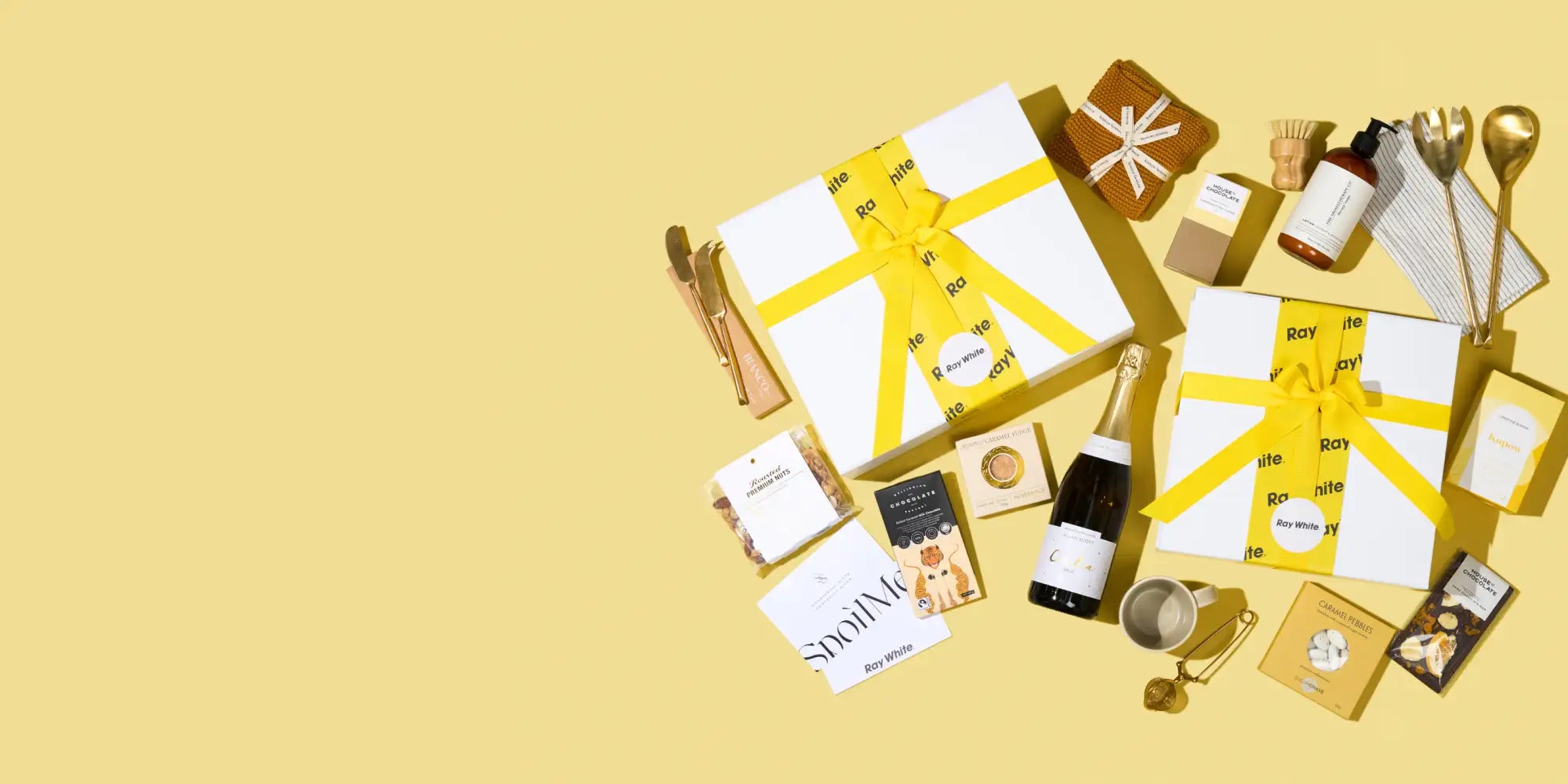 White gift box with a bright yellow ribbon tied in a bow.